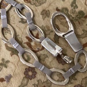 Suzi Roher grey stretch belt with silver accents and silver closure